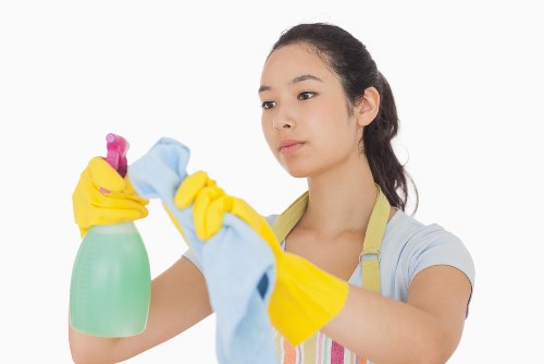 Carpet cleaning team preparing equipment with safety procedures in place